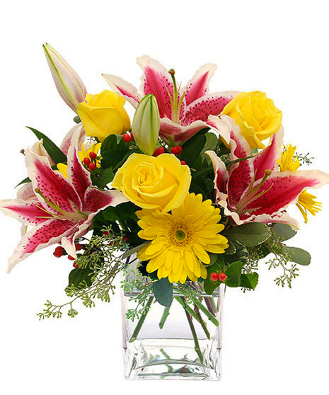 Scented Sunshine, a yellow and pink arrangement of lilies, roses and gerbera daisies