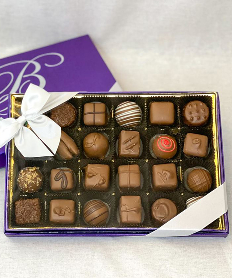 Purple box of assorted chocolates with bow