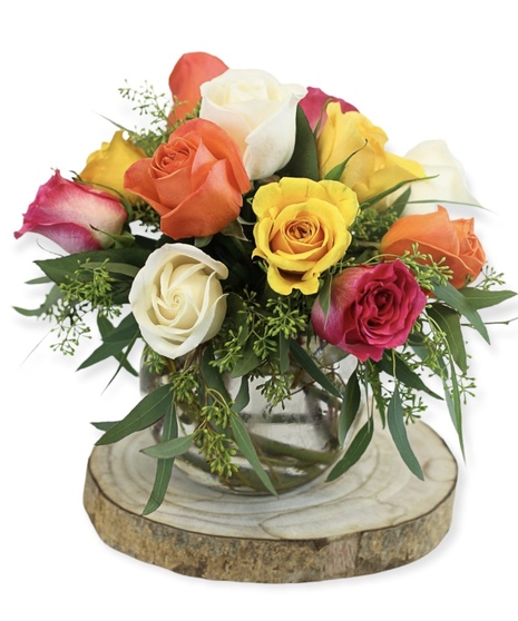 Rose Sorbet is a bubble bowl vase filled with sorbet colored roses and greenery