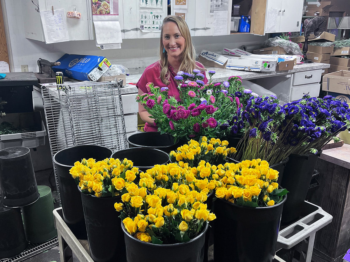 One of Bagoys' owners, Kristin, prepares a new arrangement in our floral design studio